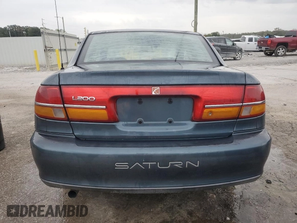2002 Saturn LS z VIN 1G8JU54F72Y581967, wystawiony jako Copart lot #74521994 z przebiegiem 215 018 mil mil oraz Szkoda całkowita • Salvage title. Historia ofert i sprzedaży dostępna na DreamBid. Obrazek 6.