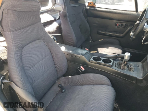 1990 Mazda MX-5 Miata z VIN JM1NA3511L0106323, wystawiony jako Copart lot #50449685 z przebiegiem 179 018 mil mil oraz Szkoda całkowita • Salvage title. Historia ofert i sprzedaży dostępna na DreamBid. Obrazek 10.