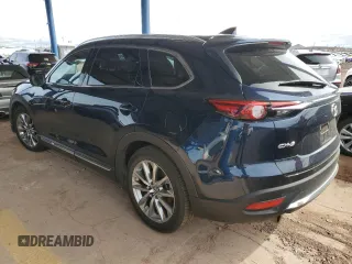 2018 Mazda CX-9 Grand Touring z VIN JM3TCADY2J0220873, wystawiony jako Copart lot #49264875 z przebiegiem Nie podano mil oraz Szkoda całkowita • Salvage title. Historia ofert i sprzedaży dostępna na DreamBid. Obrazek 2.