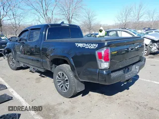2021 Toyota Tacoma 4WD SR5 with VIN 3TMDZ5BN4MM117564, listed as a IAAI auction lot 41629220 with 77,063 mi miles. Bid and sale history available at carsss.com. Image 3.