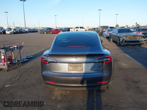 2021 Tesla Model 3 Long Range with VIN 5YJ3E1EBXMF995814, listed as a IAAI auction lot 41838453 with 51,415 mi miles. Bid and sale history available at carsss.com. Image 17.