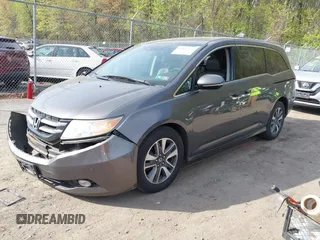 2014 Honda Odyssey Touring with VIN 5FNRL5H92EB073085, listed as a IAAI auction lot 42065913 with 120,834 mi miles and . Bid and sale history available at DreamBid. Image 2.