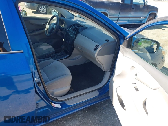 2009 Toyota Corolla with VIN JTDBL40E999021523, listed as a IAAI auction lot 42019856 with 194,011 mi miles. Bid and sale history available at carsss.com. Image 5.