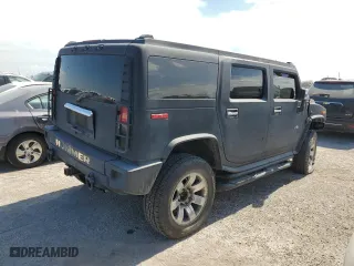 2003 Hummer H2 with VIN 5GRGN23U13H143781, listed as a Copart auction lot 74318724 with 0 mi miles and Salvage Title. Bid and sale history available at carsss.com. Image 3.