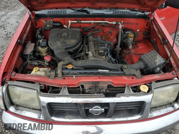 2000 Nissan Frontier XE z VIN 1N6DD21S8YC338304, wystawiony jako Copart lot #83990454 z przebiegiem 184 467 mil mil oraz Szkoda całkowita • Salvage title. Historia ofert i sprzedaży dostępna na DreamBid. Obrazek 13.