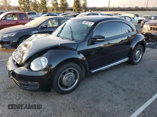 2012 Volkswagen Beetle 2.5L w/Sound/Nav PZEV with VIN 3VWJP7AT1CM623160, listed as a Copart auction lot 88076215 with 112,894 mi miles and Salvage Title. Bid and sale history available at DreamBid. Image 1.