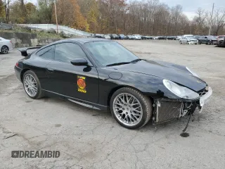 1999 Porsche 911 with VIN WP0AA2990XS626600, listed as a Copart auction lot 79217264 with 82,978 mi miles and Salvage Title. Bid and sale history available at DreamBid. Image 4.