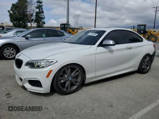 2015 BMW 2 Series M235i with VIN WBA1J7C59FV288918, listed as a Copart auction lot 51164335 with 67,791 mi miles and Salvage title. Bid and sale history available at DreamBid. Image 1.