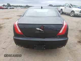 2017 Jaguar XJ with VIN SAJWA1C73H8W10544, listed as a Copart auction lot 70025724 with 64,437 mi miles and Salvage Title. Bid and sale history available at carsss.com. Image 6.