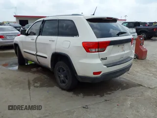 2012 Jeep Grand Cherokee Laredo with VIN 1C4RJFAG8CC124877, listed as a IAAI auction lot 41940603 with 254,356 mi miles. Bid and sale history available at carsss.com. Image 3.
