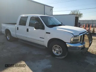 2001 Ford Super Duty F-250 XL with VIN 1FTNW20F61EB42376, listed as a Copart auction lot 74001054 with 215,944 mi miles and Salvage Title. Bid and sale history available at carsss.com. Image 4.