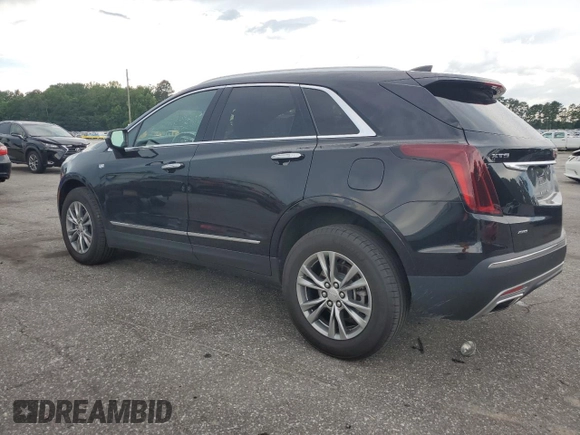 2023 Cadillac XT5 AWD Premium Luxury with VIN 1GYKNDRSXPZ145763, listed as a Copart auction lot 58387365 with 51,368 mi miles and Salvage title. Bid and sale history available at DreamBid. Image 2.
