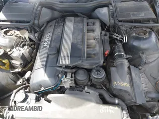 1999 BMW 5 Series 528iA with VIN WBADM6331XBY29010, listed as a IAAI auction lot 42103420 with 196,575 mi miles. Bid and sale history available at carsss.com. Image 10.