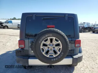 2015 Jeep Wrangler Unlimited Sahara with VIN 1C4BJWEGXFL624846, listed as a Copart auction lot 47949535 with 125,710 mi miles and Salvage Title. Bid and sale history available at carsss.com. Image 6.