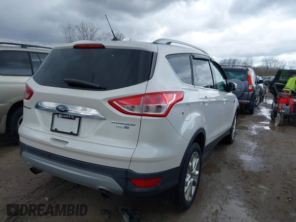 2016 Ford Escape Titanium with VIN 1FMCU9JX9GUA62674, listed as a IAAI auction lot 41838996 with 135,105 mi miles. Bid and sale history available at carsss.com. Image 4.