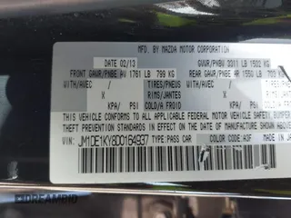 2013 Mazda 2 Sport with VIN JM1DE1KY8D0164937, listed as a IAAI auction lot 41633364 with 134,984 mi miles and . Bid and sale history available at carsss.com. Image 9.