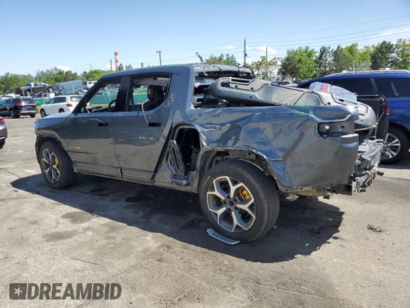 2023 Rivian R1T Adventure z VIN 7FCTGAAA4PN021950, wystawiony jako Copart lot #57800485 z przebiegiem 2 480 mil mil oraz Szkoda całkowita • Salvage title. Historia ofert i sprzedaży dostępna na DreamBid. Obrazek 2.
