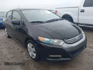 2011 Honda Insight LX z VIN JHMZE2H57BS012740, wystawiony jako IAAI lot #42337004 z przebiegiem 155 770 mil mil oraz . Historia ofert i sprzedaży dostępna na DreamBid. Obrazek 1.