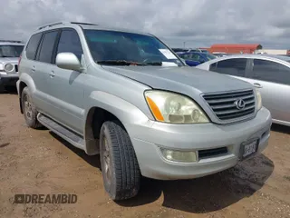 2004 Lexus GX 470 with VIN JTJBT20X840031282, listed as a IAAI auction lot 41911724 with 215,983 mi miles. Bid and sale history available at carsss.com. Image 1.
