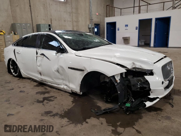 2014 Jaguar XJ Portfolio with VIN SAJWJ2GD2E8V69597, listed as a Copart auction lot 57798145 with 100,857 mi miles and Salvage title. Bid and sale history available at DreamBid. Image 4.