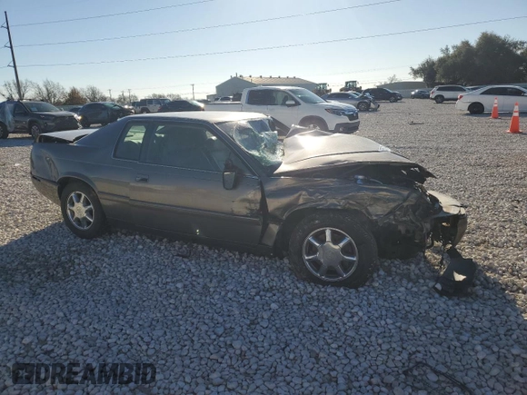 1999 Cadillac Eldorado Touring z VIN 1G6ET1299XU612153, wystawiony jako Copart lot #86257044 z przebiegiem Nie podano mil oraz Nie do naprawy. Historia ofert i sprzedaży dostępna na DreamBid. Obrazek 4.