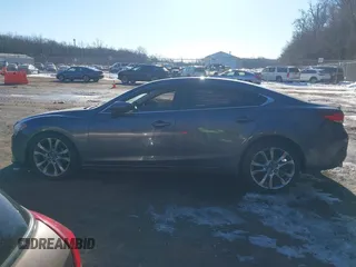 2014 Mazda 6 i Grand Touring with VIN JM1GJ1W67E1137886, listed as a IAAI auction lot 41405112 with 159,879 mi miles and . Bid and sale history available at DreamBid. Image 14.
