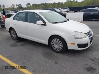 2009 Volkswagen Jetta S z VIN 3VWJZ71K19M132159, wystawiony jako IAAI lot #41904335 z przebiegiem 90 341 mil mil oraz . Historia ofert i sprzedaży dostępna na DreamBid. Obrazek 1.