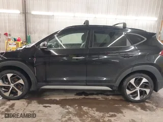 2018 Hyundai Tucson Value with VIN KM8J3CA28JU648236, listed as a IAAI auction lot 41161221 with 104,057 mi miles. Bid and sale history available at carsss.com. Image 15.