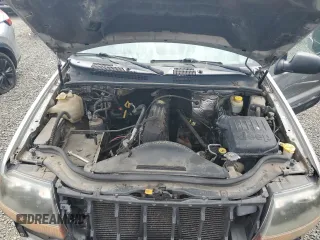 2000 Jeep Grand Cherokee Laredo with VIN 1J4GW48S9YC390448, listed as a Copart auction lot 56985265 with Not provided miles and Salvage title. Bid and sale history available at DreamBid. Image 12.
