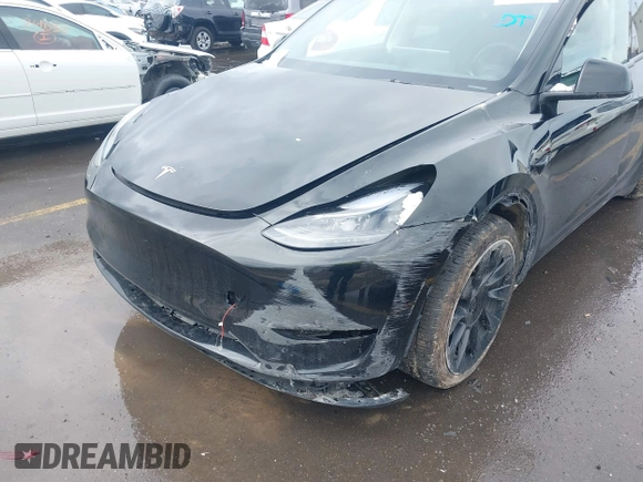 2023 Tesla Model Y Long Range with VIN 7SAYGDEE5PF766685, listed as a IAAI auction lot 41933729 with 25,959 mi miles and . Bid and sale history available at DreamBid. Image 6.