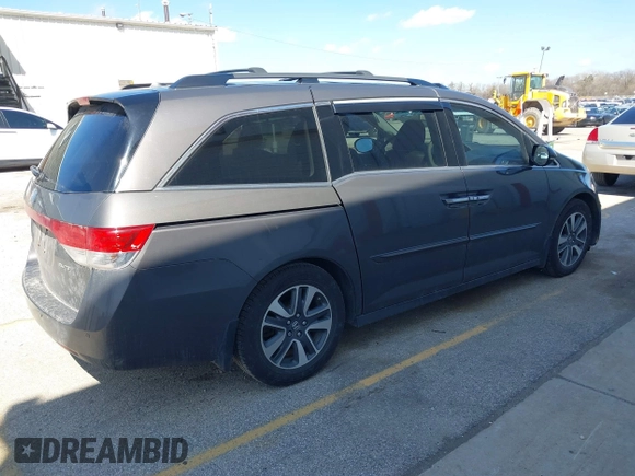2014 Honda Odyssey Touring with VIN 5FNRL5H97EB101169, listed as a IAAI auction lot 41869233 with 142,147 mi miles and . Bid and sale history available at DreamBid. Image 4.