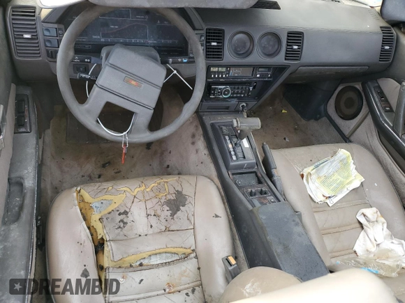 1984 Nissan 300ZX z VIN JN1HZ16S5EX016042, wystawiony jako Copart lot #86071904 z przebiegiem Nie podano mil oraz Szkoda całkowita • Salvage title. Historia ofert i sprzedaży dostępna na DreamBid. Obrazek 8.