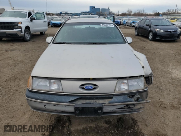 1991 Ford Taurus with VIN 1FACP52U9MG101093, listed as a Copart auction lot 45948105 with 594,696 mi miles and Salvage title. Bid and sale history available at DreamBid. Image 5.