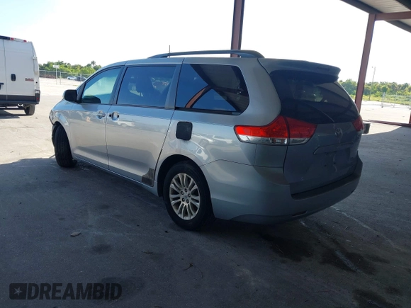 2013 Toyota Sienna XLE AAS with VIN 5TDYK3DC3DS297044, listed as a IAAI auction lot 42552470 with 143,947 mi miles and . Bid and sale history available at DreamBid. Image 3.