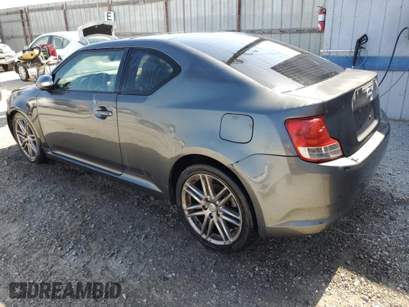 2012 Scion tC z VIN JTKJF5C70C3034928, wystawiony jako Copart lot #61272465 z przebiegiem 183 054 mil mil oraz Szkoda całkowita • Salvage title. Historia ofert i sprzedaży dostępna na DreamBid. Obrazek 2.