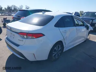 2020 Toyota Corolla Hybrid LE with VIN JTDEBRBEXLJ013138, listed as a IAAI auction lot 40269735 with 140,602 mi miles. Bid and sale history available at carsss.com. Image 4.