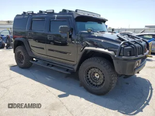 2005 Hummer H2 SUV z VIN 5GRGN23U05H117630, wystawiony jako Copart lot #57087305 z przebiegiem 60 260 mil mil oraz Szkoda całkowita • Salvage title. Historia ofert i sprzedaży dostępna na DreamBid. Obrazek 4.
