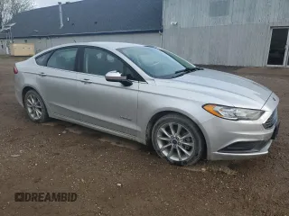 2017 Ford Fusion Hybrid SE z VIN 3FA6P0LU4HR384645, wystawiony jako Copart lot #56454995 z przebiegiem 165 322 mil mil oraz Czysty tytuł • Clean title. Historia ofert i sprzedaży dostępna na DreamBid. Obrazek 4.