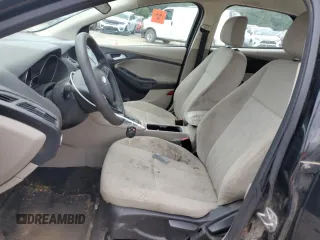 2018 Ford Focus SE z VIN 1FADP3F28JL319269, wystawiony jako Copart lot #59604555 z przebiegiem 167 726 mil mil oraz Szkoda całkowita • Salvage title. Historia ofert i sprzedaży dostępna na DreamBid. Obrazek 7.
