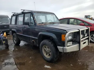 1991 Isuzu Trooper z VIN JACCH58E3M7900325, wystawiony jako Copart lot #79525294 z przebiegiem 146 593 mil mil oraz Czysty tytuł • Clean title. Historia ofert i sprzedaży dostępna na DreamBid. Obrazek 4.