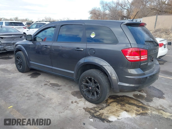 2014 Dodge Journey American Value Pkg with VIN 3C4PDCAB5ET235427, listed as a IAAI auction lot 41056216 with 164,740 mi miles. Bid and sale history available at carsss.com. Image 3.