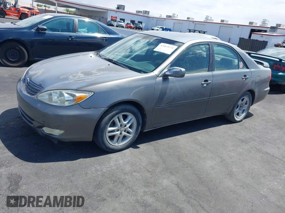 2003 Toyota Camry LE with VIN JTDBE32K130149032, listed as a IAAI auction lot 42063174 with 241,424 mi miles and . Bid and sale history available at DreamBid. Image 14.