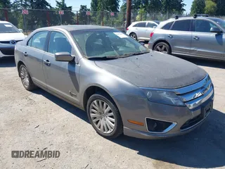 2010 Ford Fusion Hybrid z VIN 3FADP0L35AR194521, wystawiony jako IAAI lot #42432994 z przebiegiem 159 958 mil mil oraz . Historia ofert i sprzedaży dostępna na DreamBid. Obrazek 1.