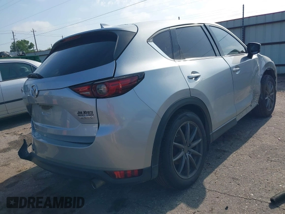 2020 Mazda CX-5 Grand Touring with VIN JM3KFADM5L0739306, listed as a IAAI auction lot 42215667 with 126,100 mi miles and . Bid and sale history available at DreamBid. Image 4.