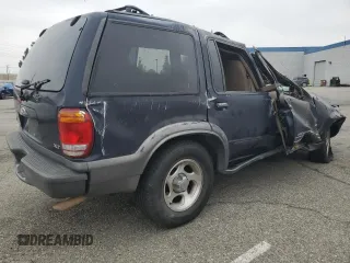 1999 Ford Explorer XLT with VIN 1FMZU34E6XZC14009, listed as a Copart auction lot 55251525 with 253,681 mi miles and Salvage title. Bid and sale history available at DreamBid. Image 3.