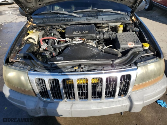 1999 Jeep Grand Cherokee Laredo with VIN 1J4GW58N9XC633464, listed as a Copart auction lot 84682454 with 212,738 mi miles and Salvage Title. Bid and sale history available at carsss.com. Image 12.
