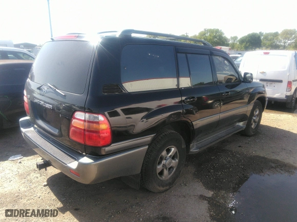 2001 Toyota Land Cruiser with VIN JTEHT05J512016563, listed as a IAAI auction lot 41868193 with 247,653 mi miles. Bid and sale history available at carsss.com. Image 4.