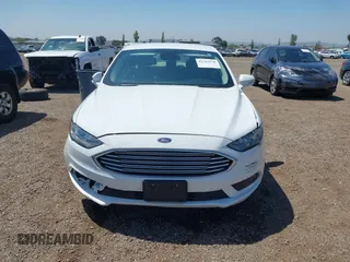 2018 Ford Fusion SE z VIN 3FA6P0LU2JR261268, wystawiony jako IAAI lot #42301578 z przebiegiem 63 357 mil mil oraz . Historia ofert i sprzedaży dostępna na DreamBid. Obrazek 12.