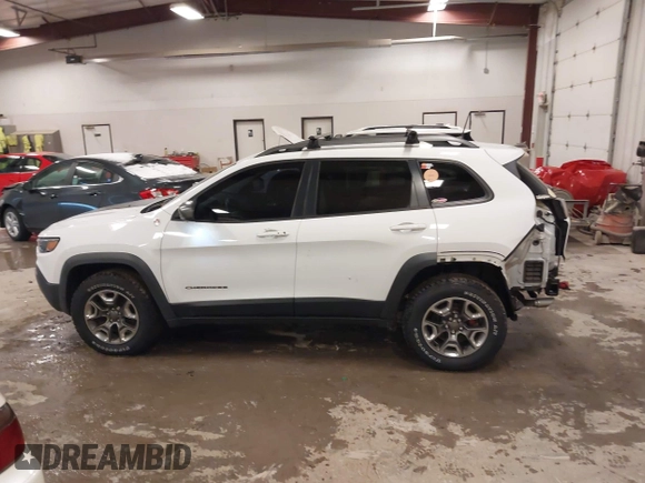 2019 Jeep Cherokee Trailhawk with VIN 1C4PJMBX4KD390061, listed as a IAAI auction lot 42007112 with 72,227 mi miles and . Bid and sale history available at DreamBid. Image 14.