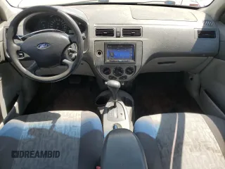 2005 Ford Focus S with VIN 1FAFP34N05W296550, listed as a Copart auction lot 59391835 with 216,509 mi miles and Salvage title. Bid and sale history available at DreamBid. Image 8.